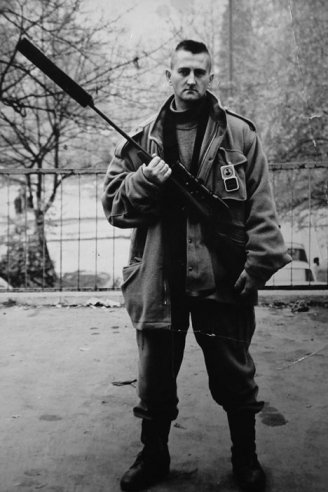 Adela Jusic, 'The Sniper', 2007, film/animation. Photograph of Jusic's father in uniform holding his sniper's rifle. Image courtesy the artist and www.alancristea.com