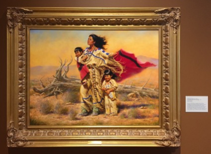Alfredo Rodriguez, 'Wind beneath their wings', 2001, oil on canvas, at Booth Western Art Museum, Cartersville, GA. Photo credit Kelise Franclemont. The card reads: '...Rodriguez pays tribute to Native American women in this romanticised work. Such idealistic portrayals, however, are at odds with the hardship that often characterised the lives of the Plains Indians. Rodriguez, one of nine children, was born in Mexico near a Huichot Indian community.'
